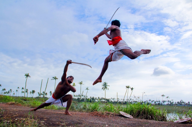 Kalaripayattu_mock_combat_in_rural_Kerala
