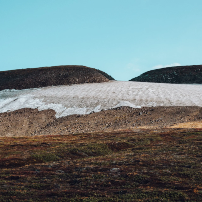 Photo by ROMAN ODINTSOV: https://www.pexels.com/photo/desert-valley-with-band-of-snow-on-top-4555677/