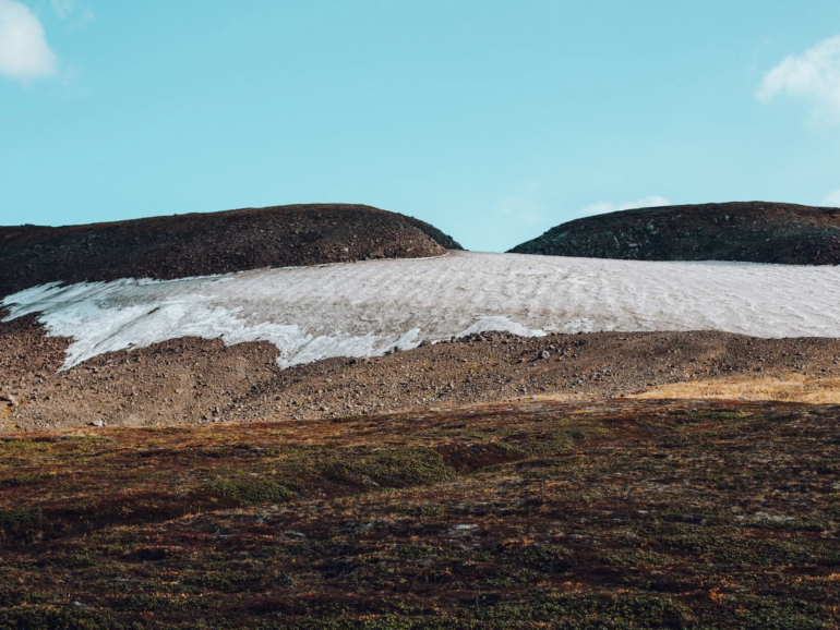 Photo by ROMAN ODINTSOV: https://www.pexels.com/photo/desert-valley-with-band-of-snow-on-top-4555677/